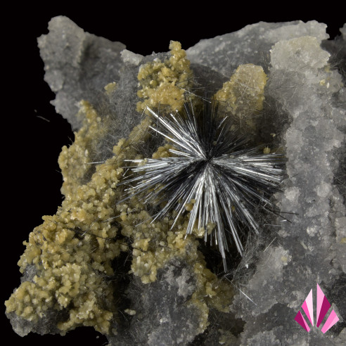 Stibine and calcite: elongated, often shiny crystals with a metallic sheen.